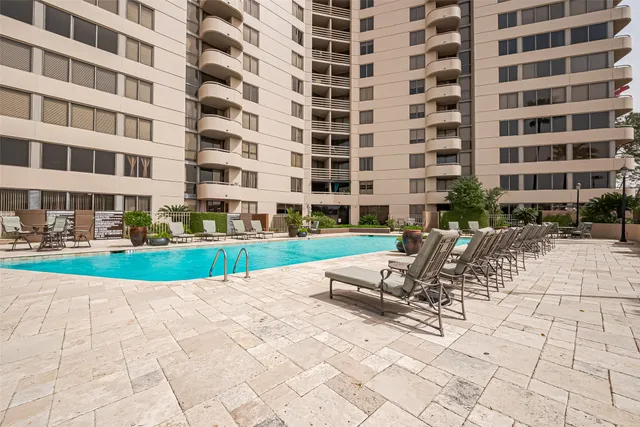 a view of a swimming pool with a patio