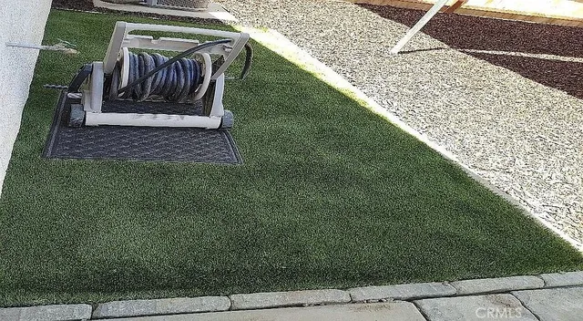 a view of a backyard of the house