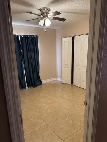 a view of a storage and utility room with a sink