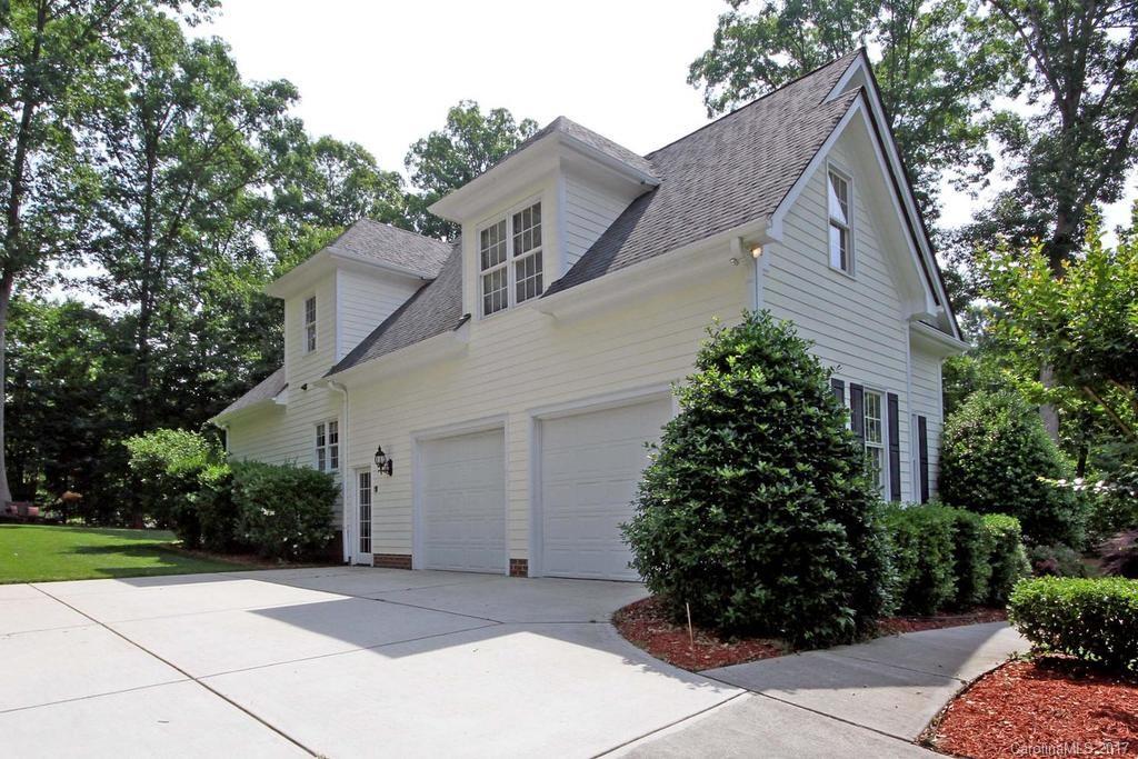 3867 Lake Shore Road South Denver, NC 28037 - Photo 22 of 24 a front view of a house with garden