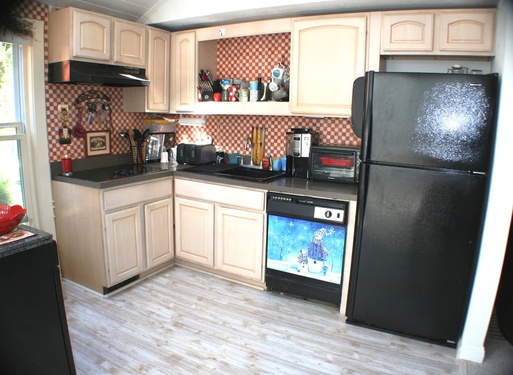 39 Lathrop Road Bourne, MA 02562 - Photo 8 of 22 a kitchen with stainless steel appliances granite countertop a refrigerator and a stove