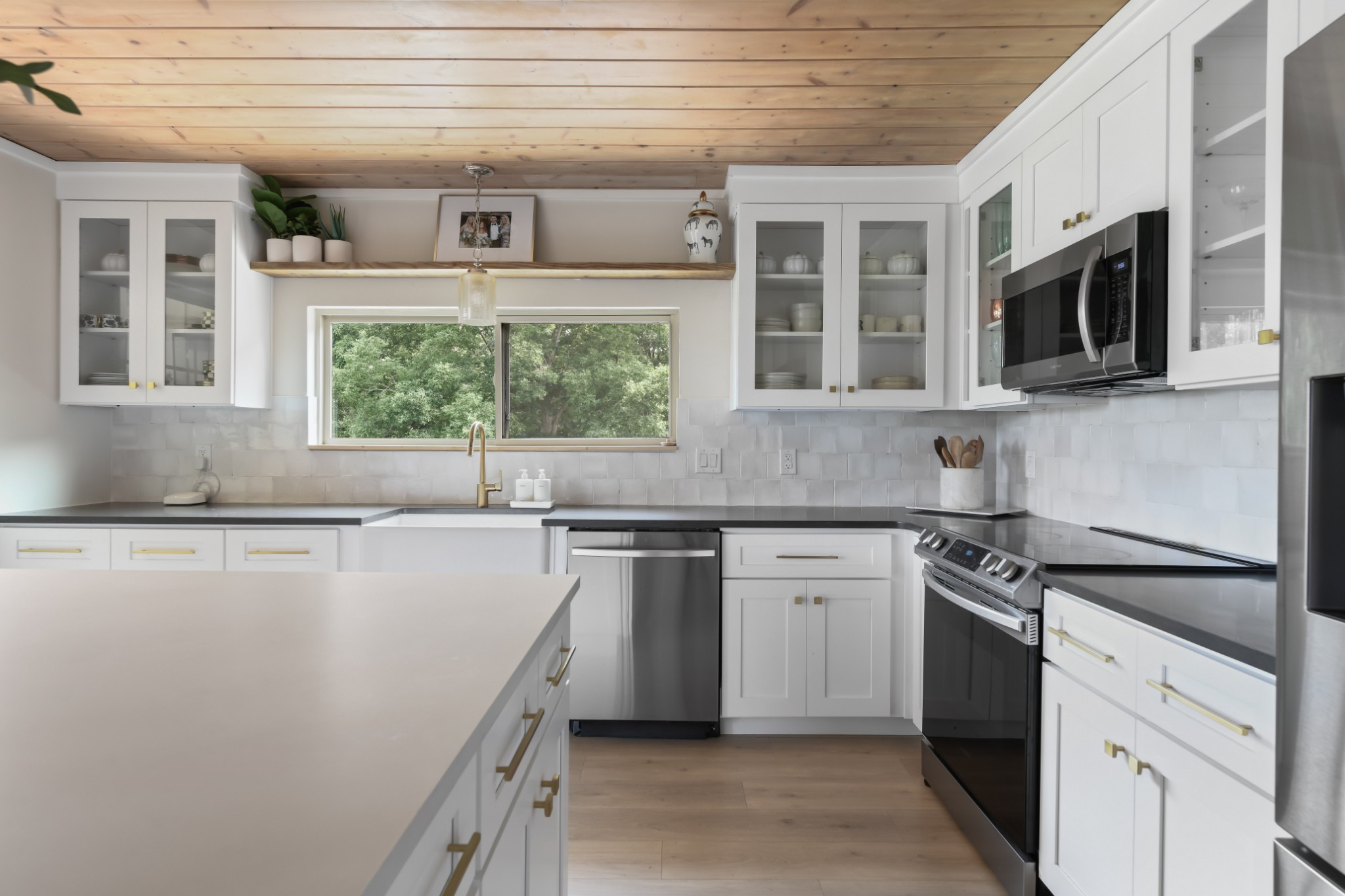 7720 Smith Road Primm Springs, TN 38476 - Photo 14 of 58 a kitchen with a sink stove and microwave