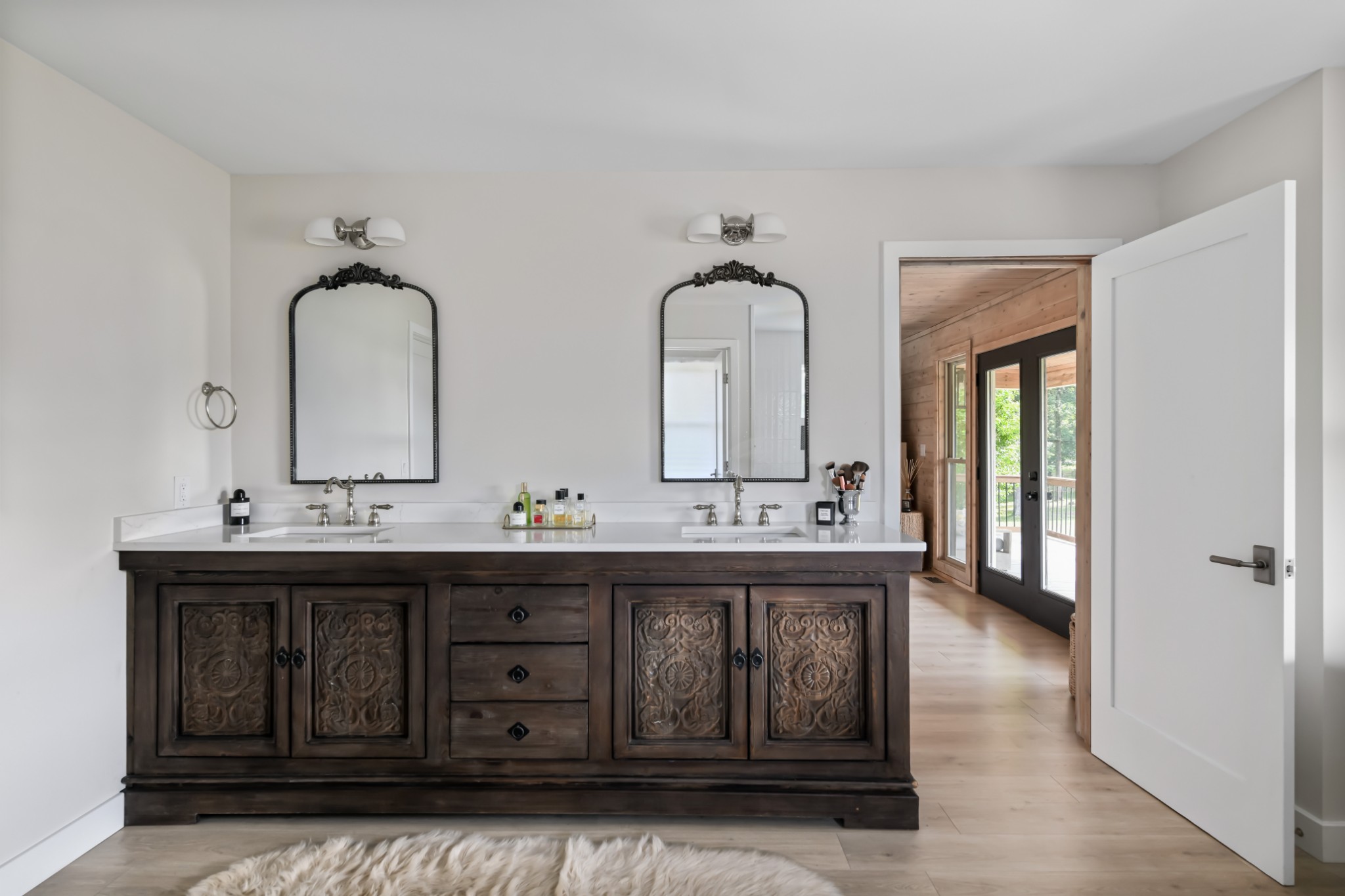 7720 Smith Road Primm Springs, TN 38476 - Photo 24 of 58 a bathroom with a double vanity sink and mirror