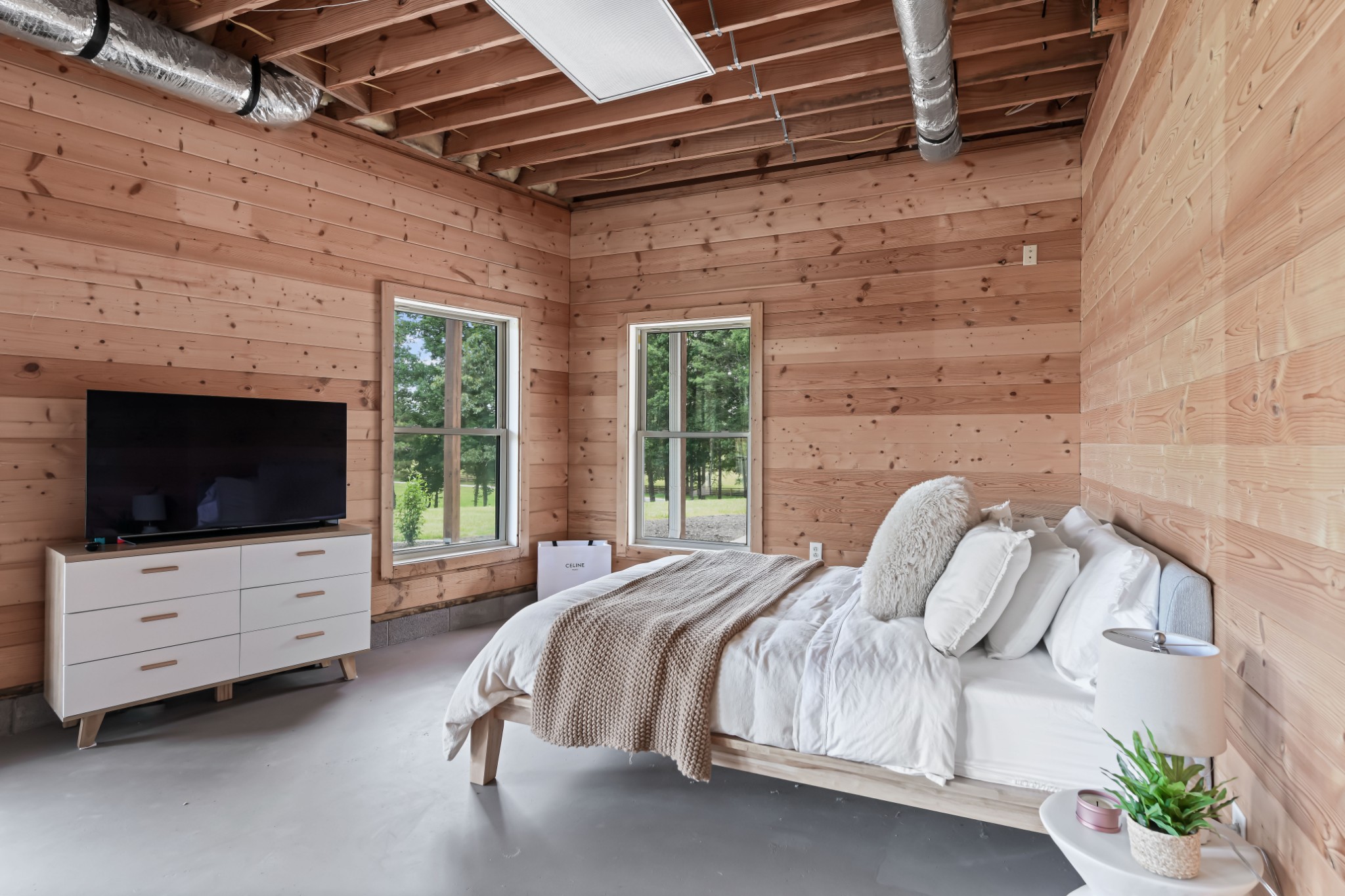 7720 Smith Road Primm Springs, TN 38476 - Photo 33 of 58 a bedroom with a bed and flat screen tv