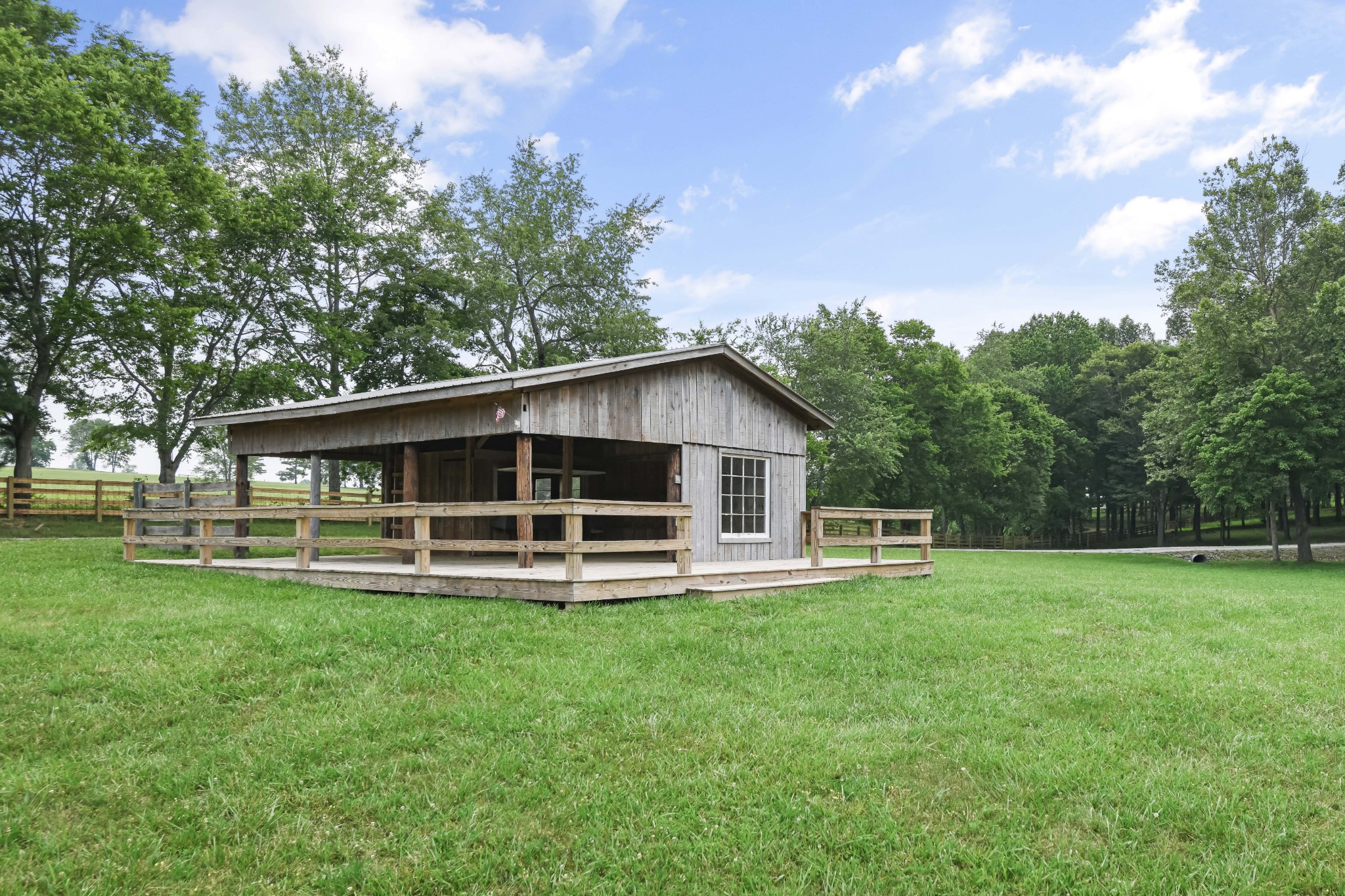 7720 Smith Road Primm Springs, TN 38476 - Photo 40 of 58 a front view of a house with a yard and trees