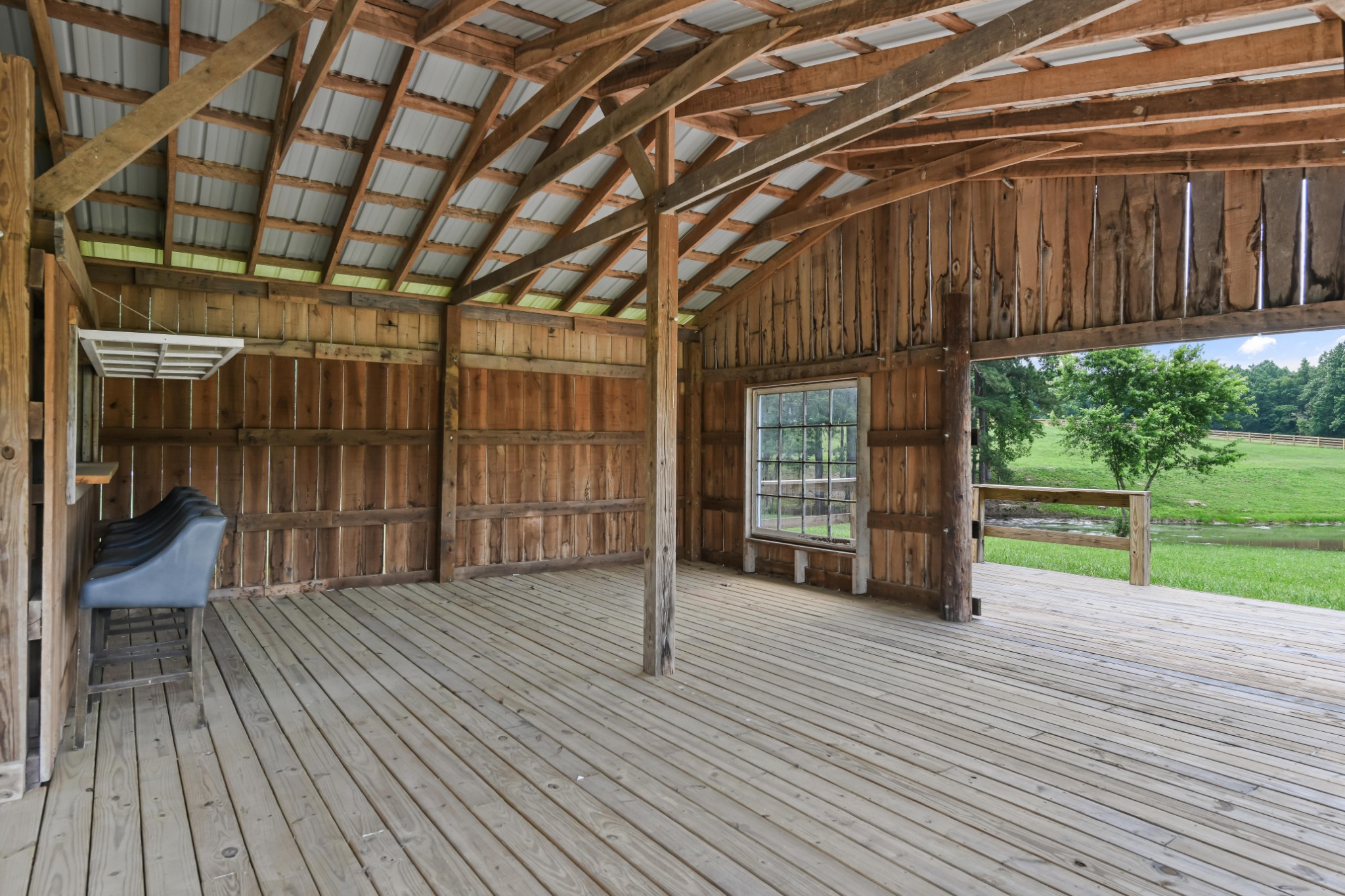 7720 Smith Road Primm Springs, TN 38476 - Photo 42 of 58 a view of a porch with wooden floor and fence