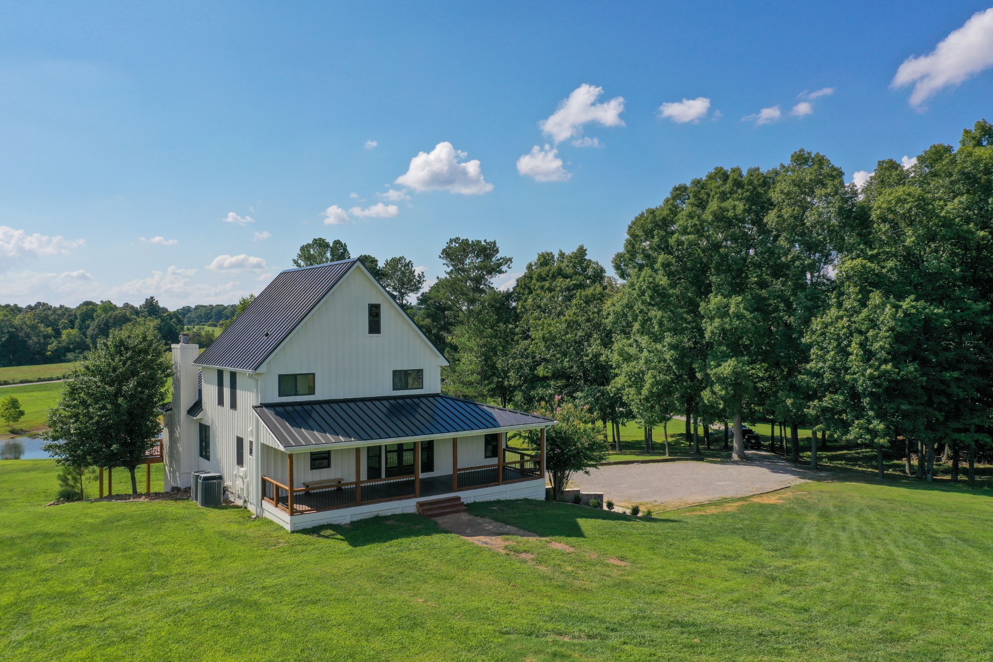 7720 Smith Road Primm Springs, TN 38476 - Photo 43 of 58 a view of a house with a big yard and sitting area