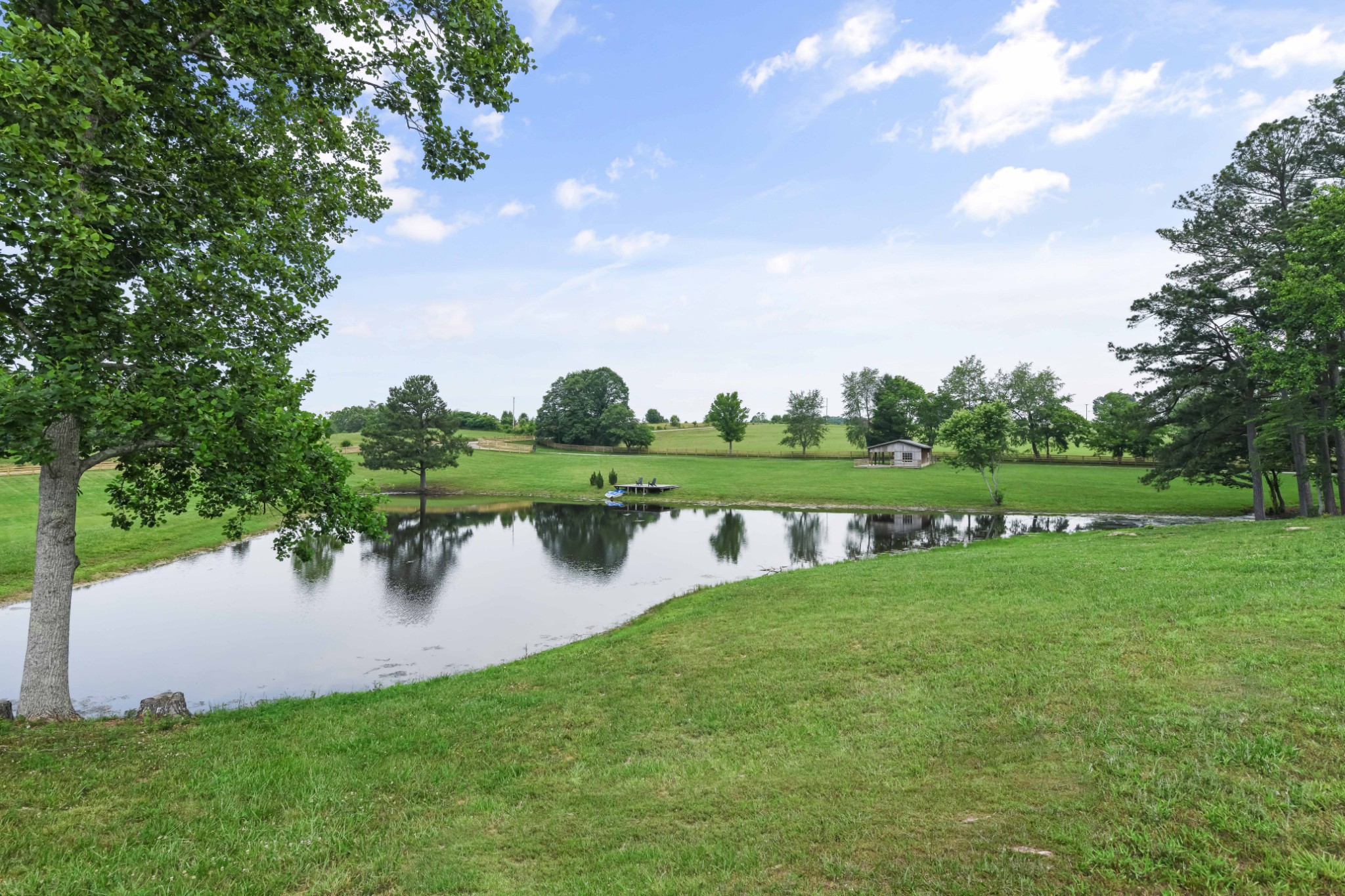 7720 Smith Road Primm Springs, TN 38476 - Photo 52 of 58 a view of a lake with a big yard