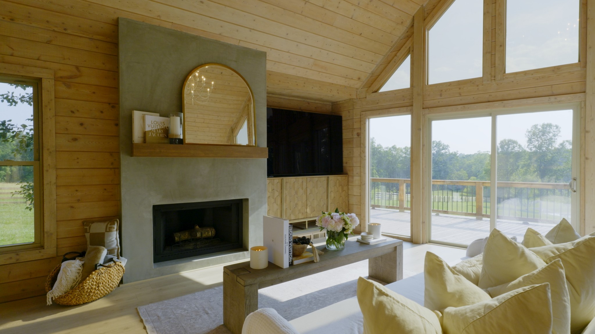 7720 Smith Road Primm Springs, TN 38476 - Photo 8 of 58 a living room with furniture a fireplace and a floor to ceiling window
