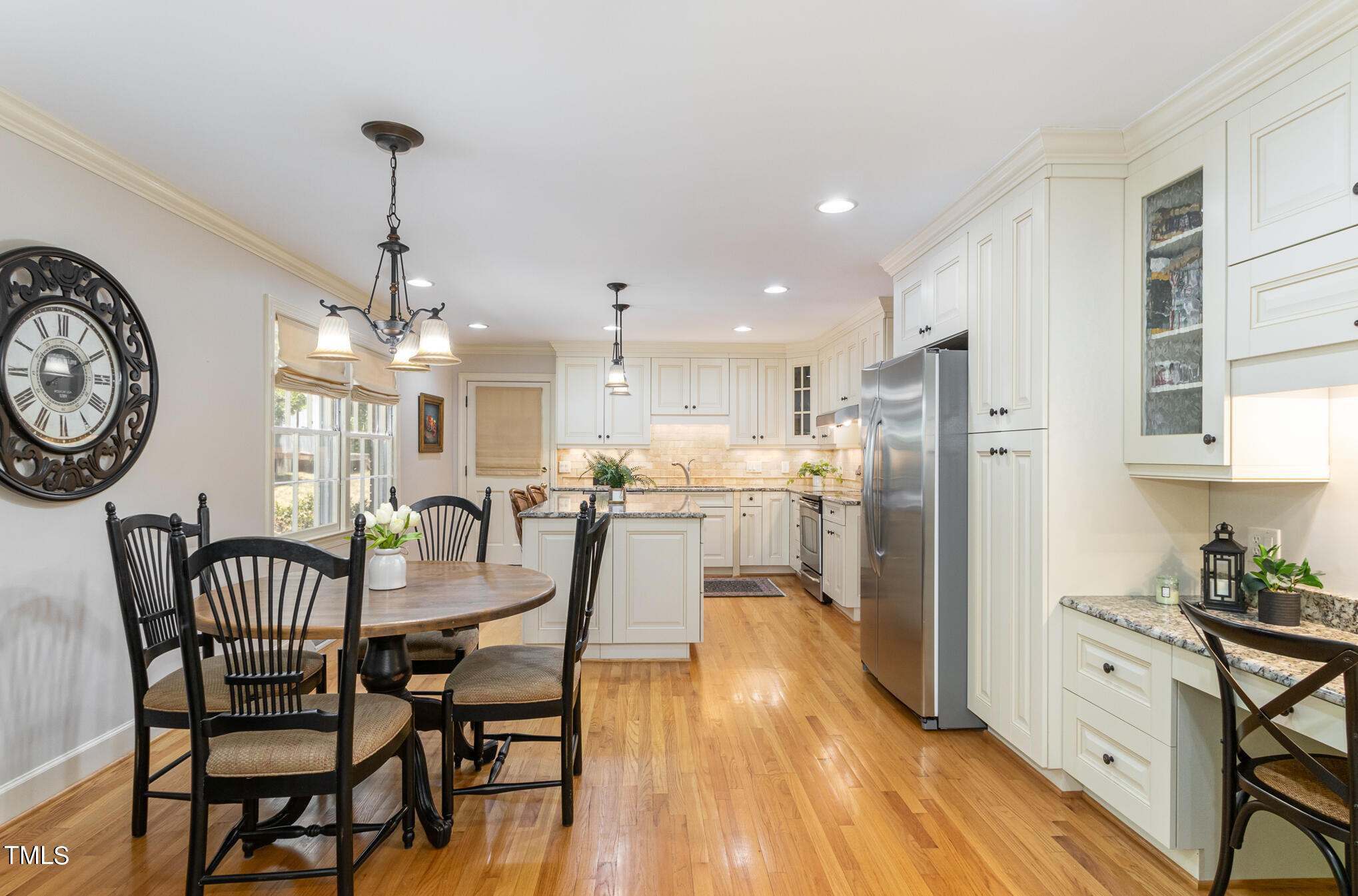 2901 Augusta Court Raleigh, NC 27607 - Photo 12 of 28 a view of a dining room with furniture a kitchen and chandelier