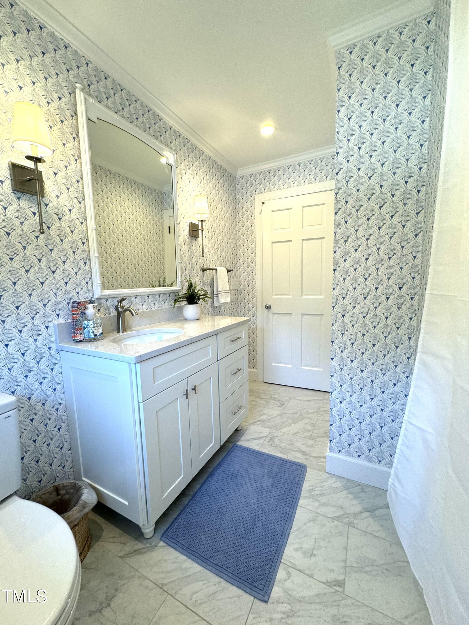 2901 Augusta Court Raleigh, NC 27607 - Photo 15 of 28 a bathroom with a sink a toilet and shower