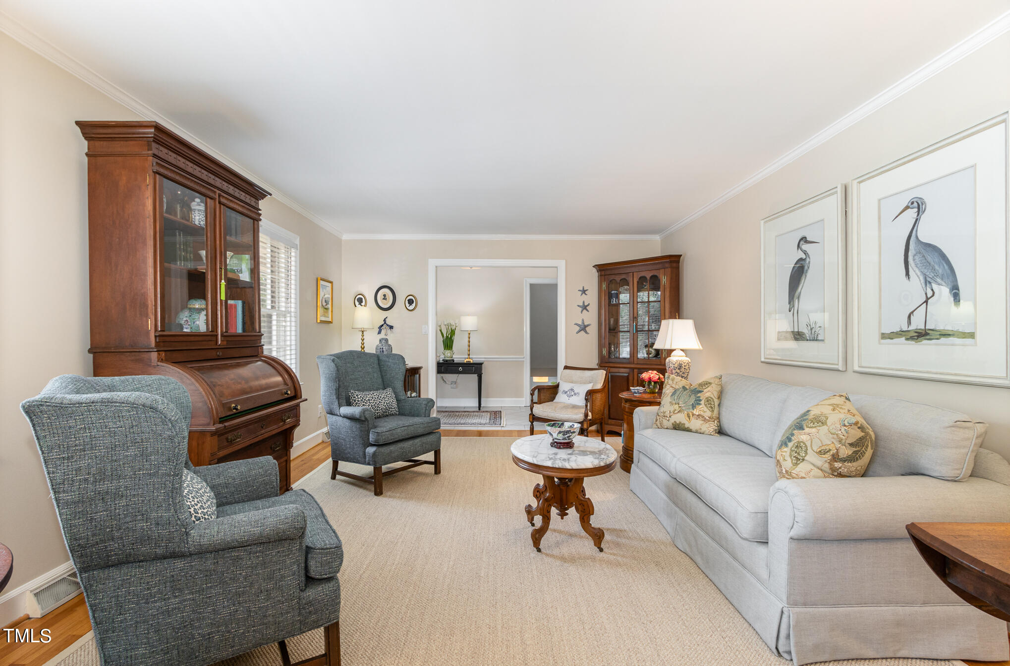 2901 Augusta Court Raleigh, NC 27607 - Photo 4 of 28 a living room with furniture and a potted plant