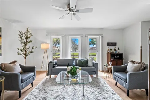 a view of a dining room with furniture and wooden floor