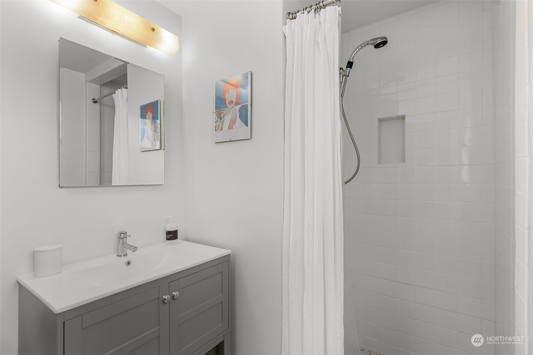 2520 South Raymond Street Seattle, WA 98108 - Photo 16 of 39 a bathroom with a sink and mirror