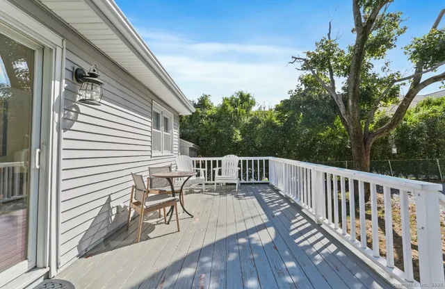 a view of balcony with deck and wooden floor