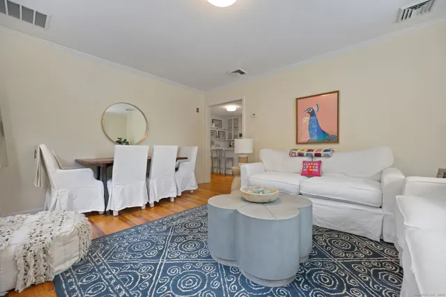 a living room with furniture and a rug