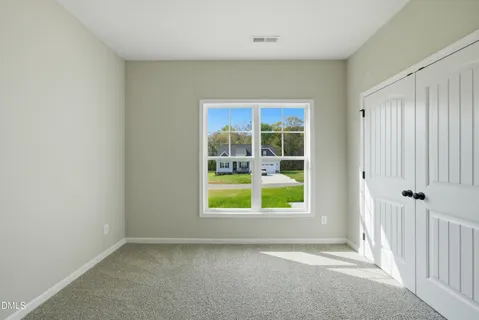 a view of a kitchen with wooden floor and a kitchen