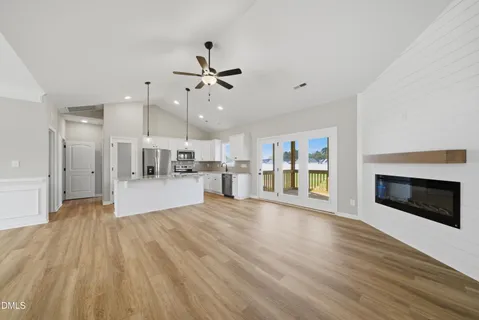 a view of kitchen with sink and microwave