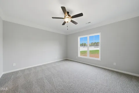 a spacious bathroom with a double vanity sink a mirror and a shower
