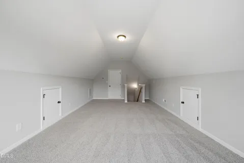 a view of kitchen with kitchen island and stainless steel appliances