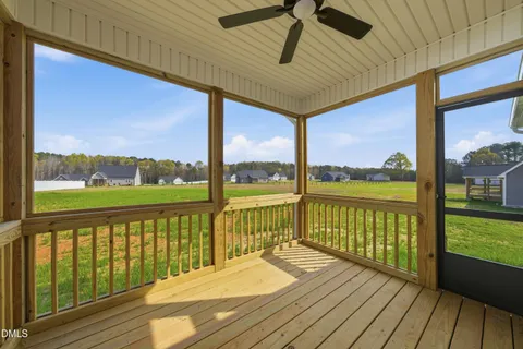 a view of a balcony with wooden floor