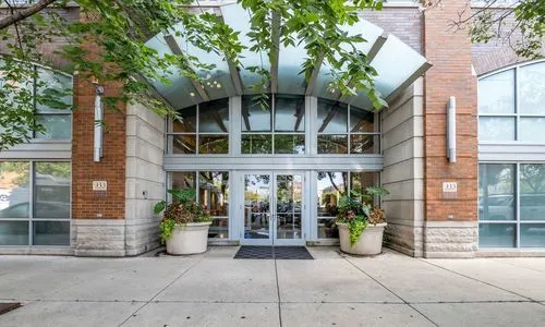 a view of a building with potted plants