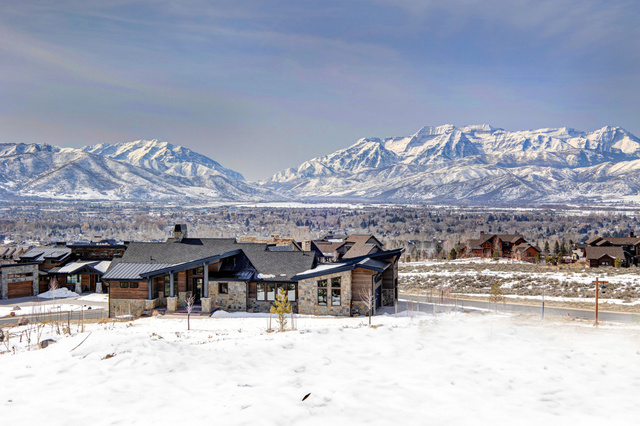 1282 Chimney Rock Road, Unit 344 Heber City, UT 84032 - Photo 53 of 55 Contemporary mountain home featuring a stone and wood exterior, multiple rooflines, and a dark shingle roof