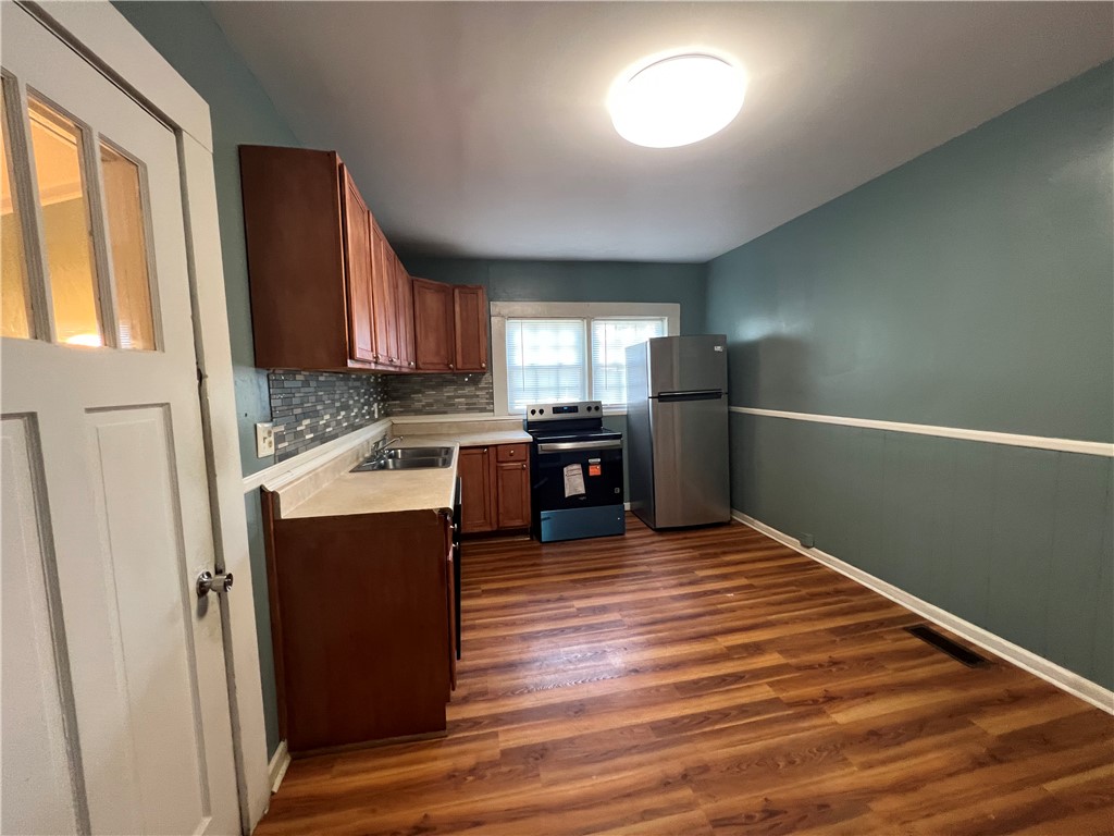 309 Jaynes Street Walhalla, SC 29691 - Photo 8 of 12 Functional kitchen with ample cabinet space and modern appliances for daily living.