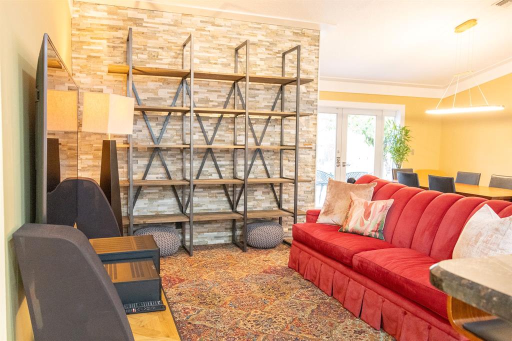 12555 Southwest 7th Place Davie, FL 33325 - Photo 7 of 34 a living room with furniture and a floor to ceiling window