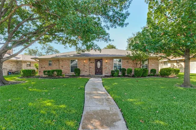 front view of a house and a yard