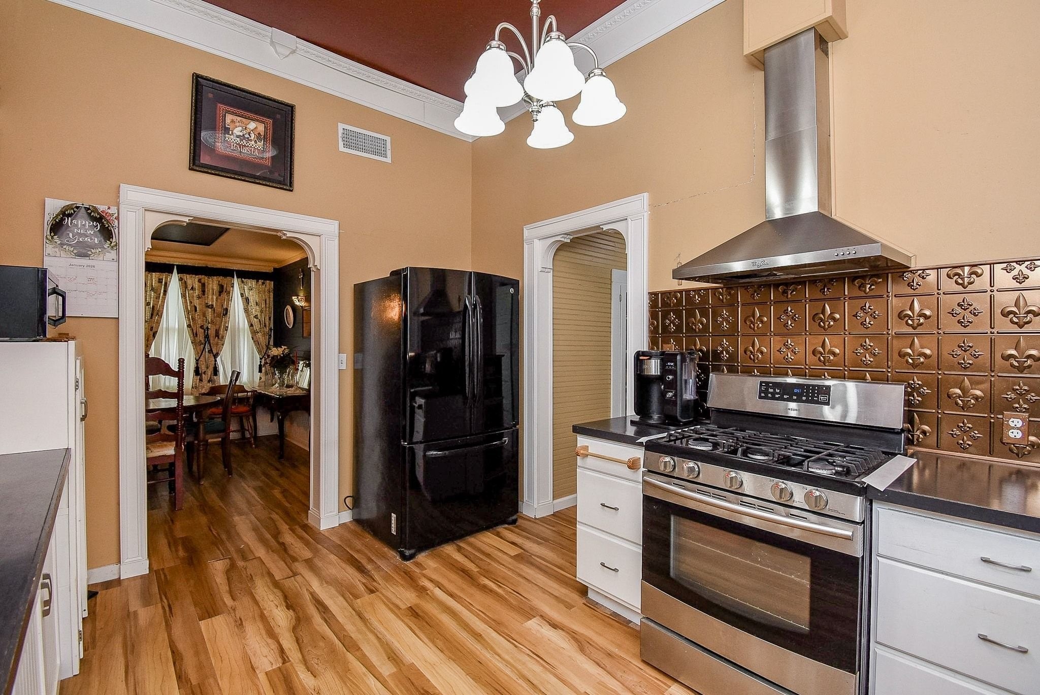 807 Clipson Road Eagle Lake, TX 77434 - Photo 11 of 31 a kitchen with stainless steel appliances granite countertop a stove cabinets and wooden floor