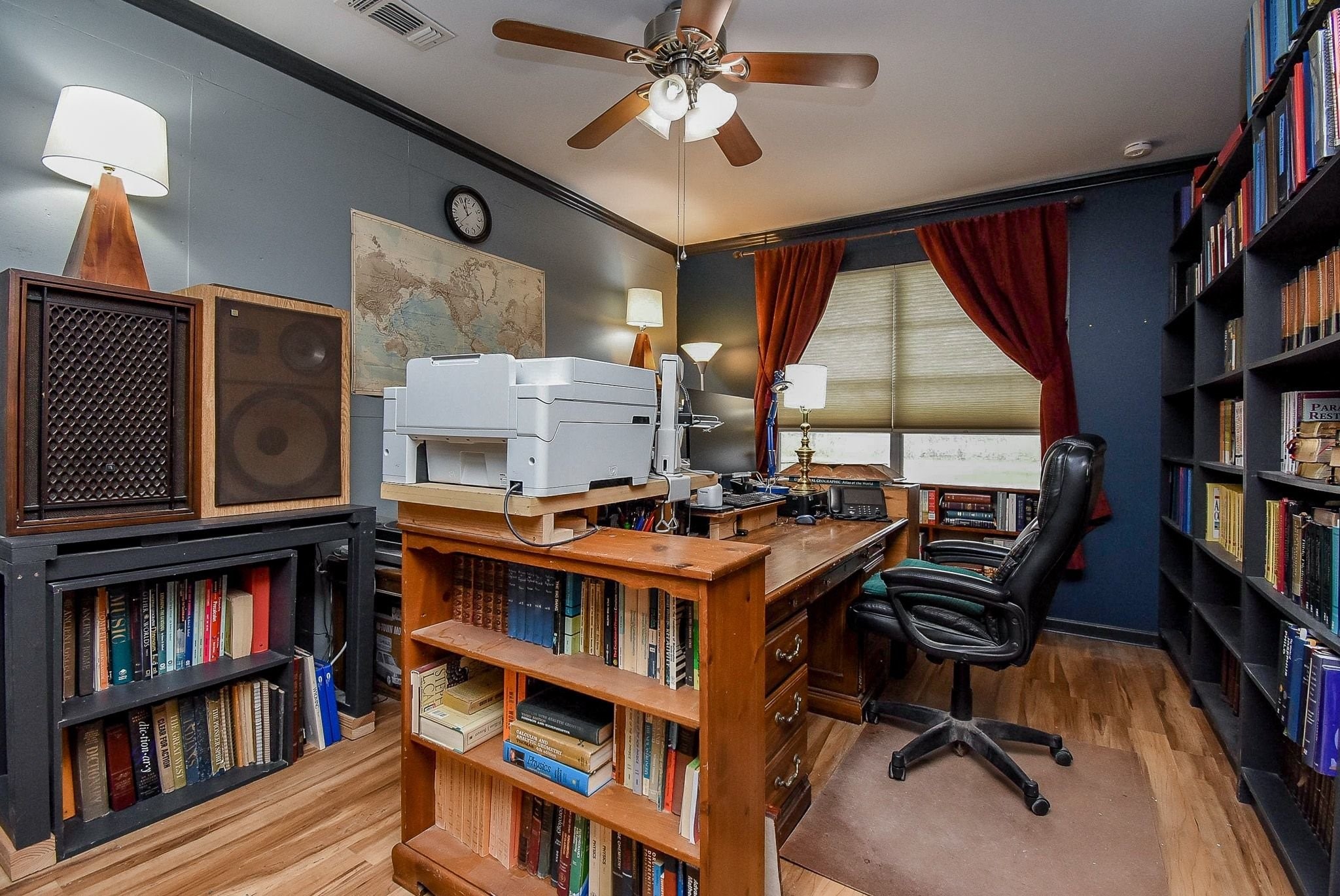 807 Clipson Road Eagle Lake, TX 77434 - Photo 23 of 31 a view of a workspace with furniture and a book shelf