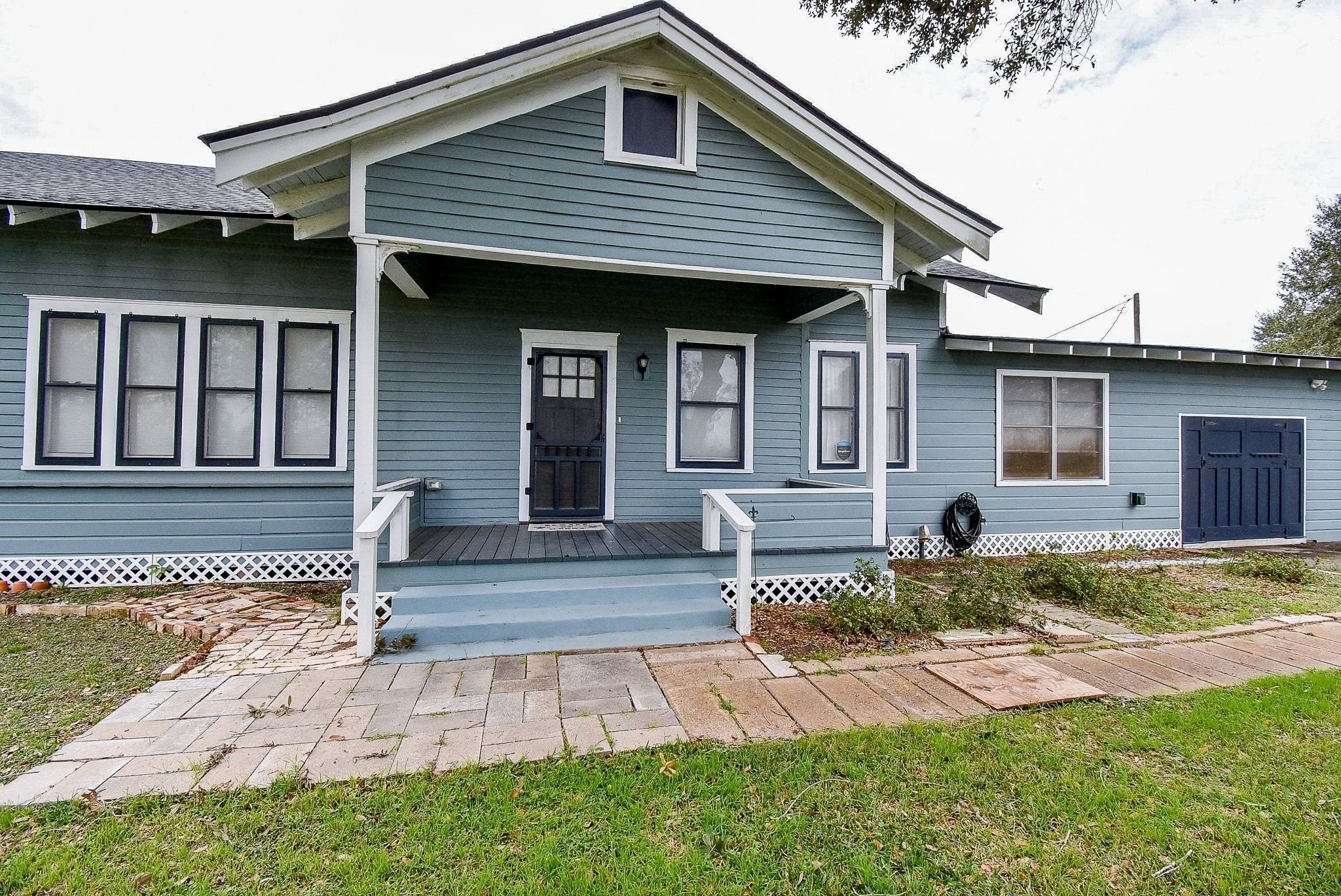 807 Clipson Road Eagle Lake, TX 77434 - Photo 3 of 31 a front view of a house with a yard outdoor seating and yard