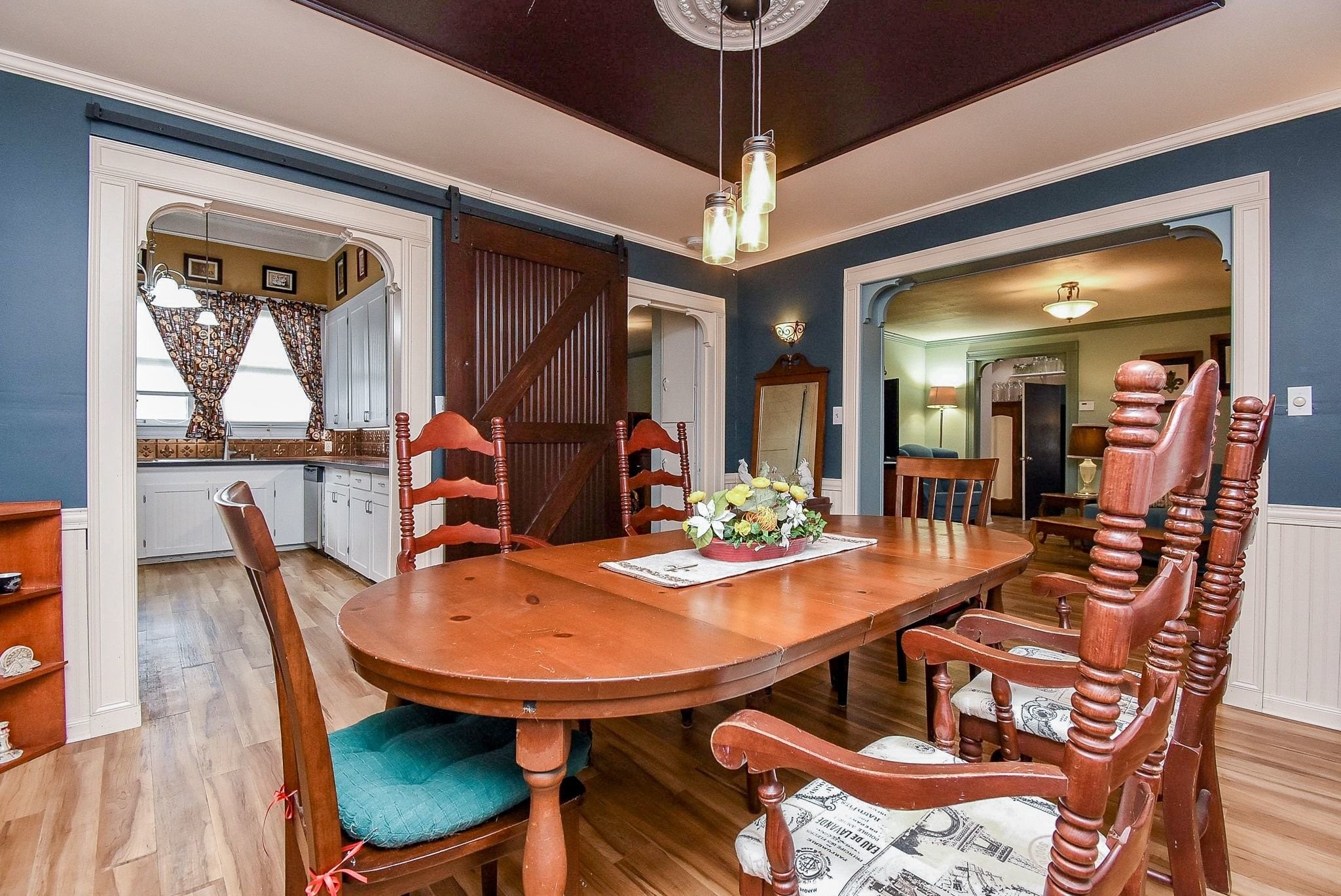 807 Clipson Road Eagle Lake, TX 77434 - Photo 8 of 31 a dining room with furniture a chandelier and wooden floor