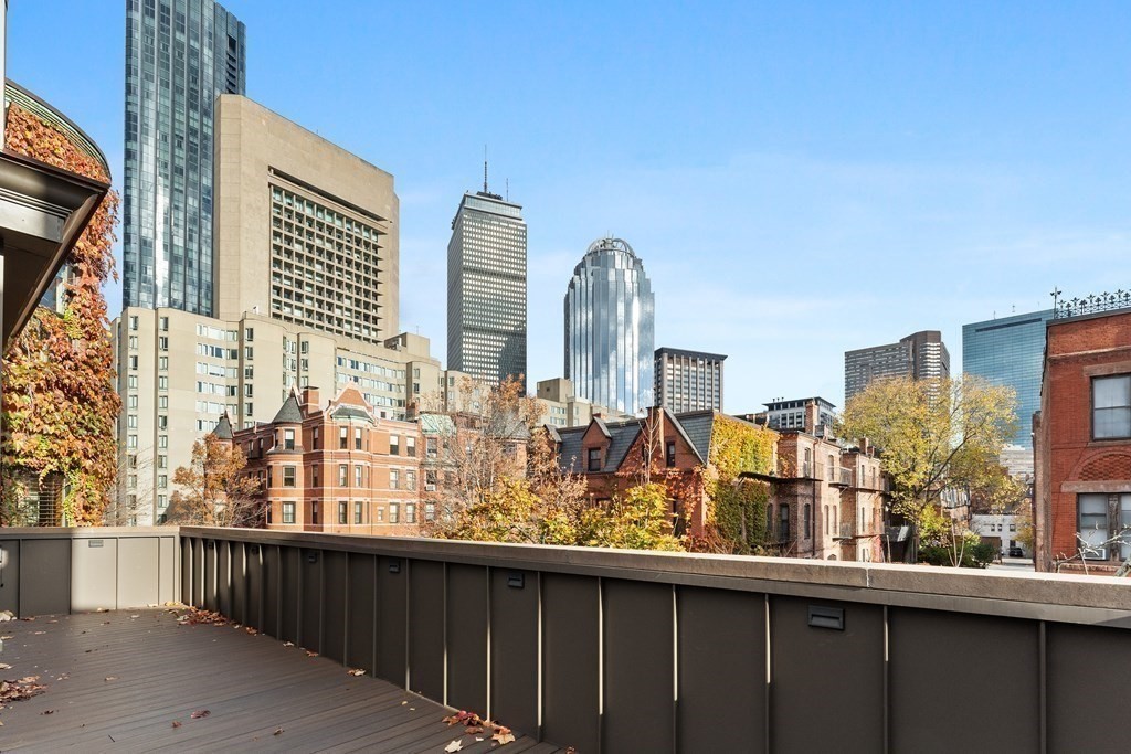 136 St Botolph Street Boston, MA 02115 - Photo 2 of 40 a view of a balcony with large trees