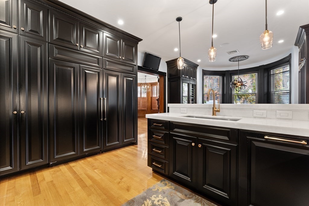 136 St Botolph Street Boston, MA 02115 - Photo 32 of 40 a kitchen with stainless steel appliances granite countertop cabinets a refrigerator and a sink