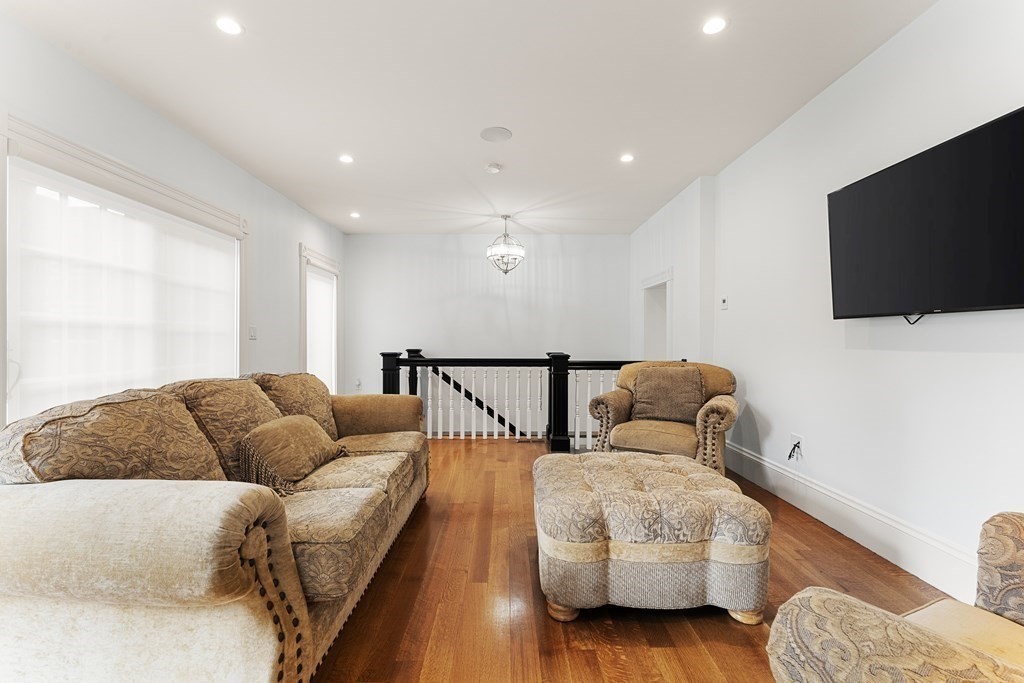 136 St Botolph Street Boston, MA 02115 - Photo 35 of 40 a living room with furniture and a flat screen tv