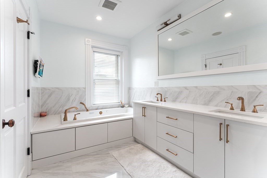 136 St Botolph Street Boston, MA 02115 - Photo 7 of 40 a bathroom with a sink double vanity and tub