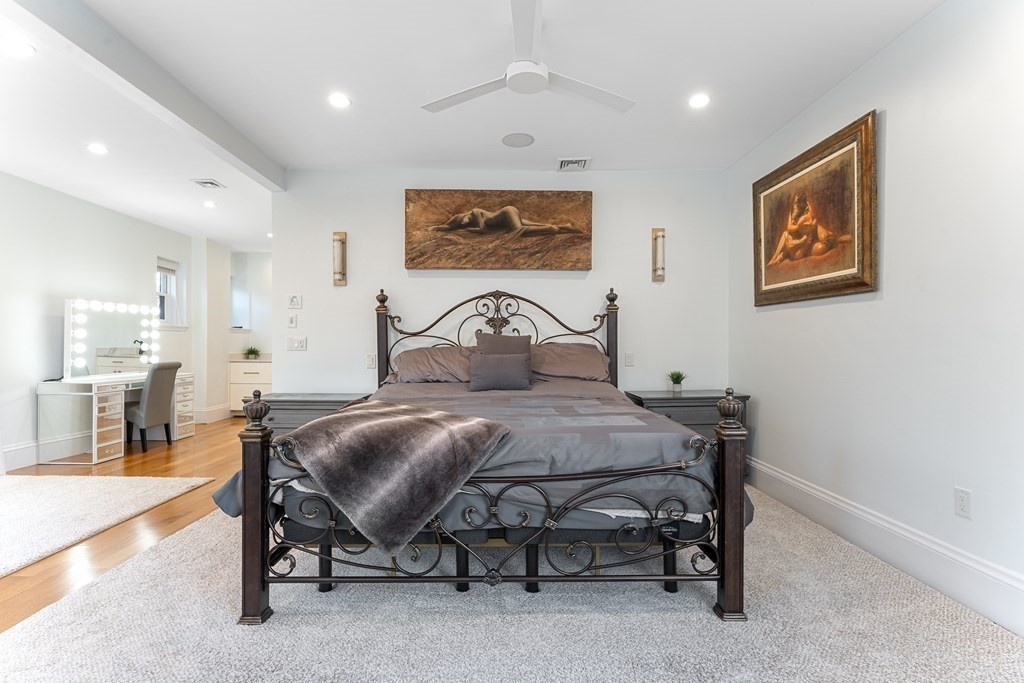 136 St Botolph Street Boston, MA 02115 - Photo 9 of 40 a bedroom with a bed and glass windows