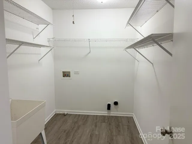 a view of a room with racks on the wall