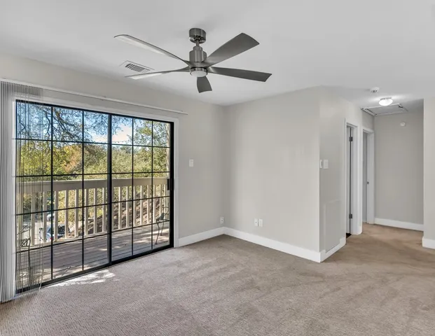 a view of a room with a large window