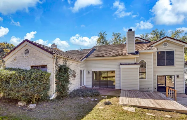 a front view of a house with a yard garage and outdoor seating