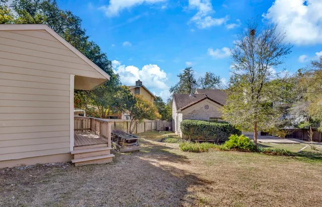 a view of a chair and tables in the patio