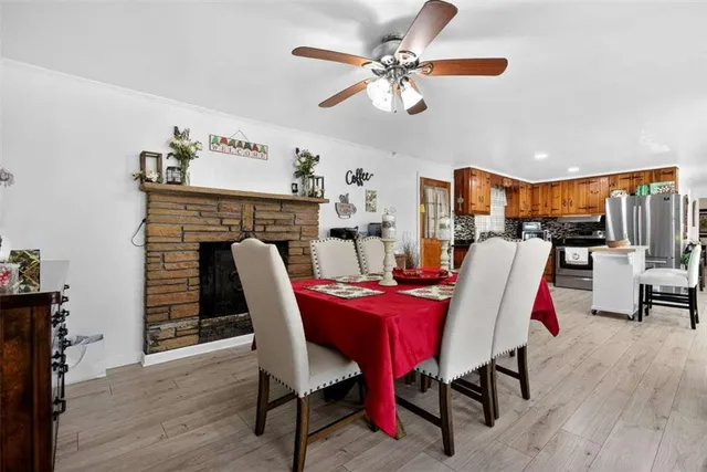 a bedroom with a bed dresser and wooden floor
