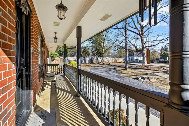 a view of a balcony with car parked