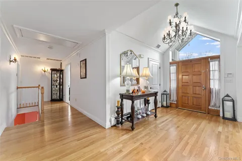 a view of a livingroom with furniture window and wooden floor