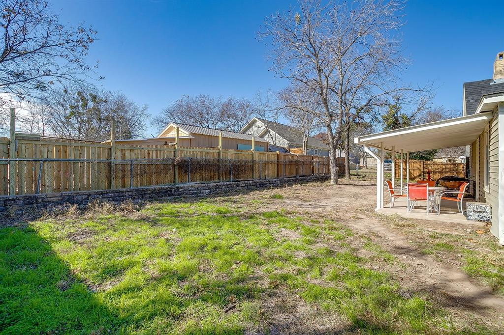610 North Mesquite Hico, TX 76457 - Photo 28 of 34 a view of a backyard with a small cabin and a chair