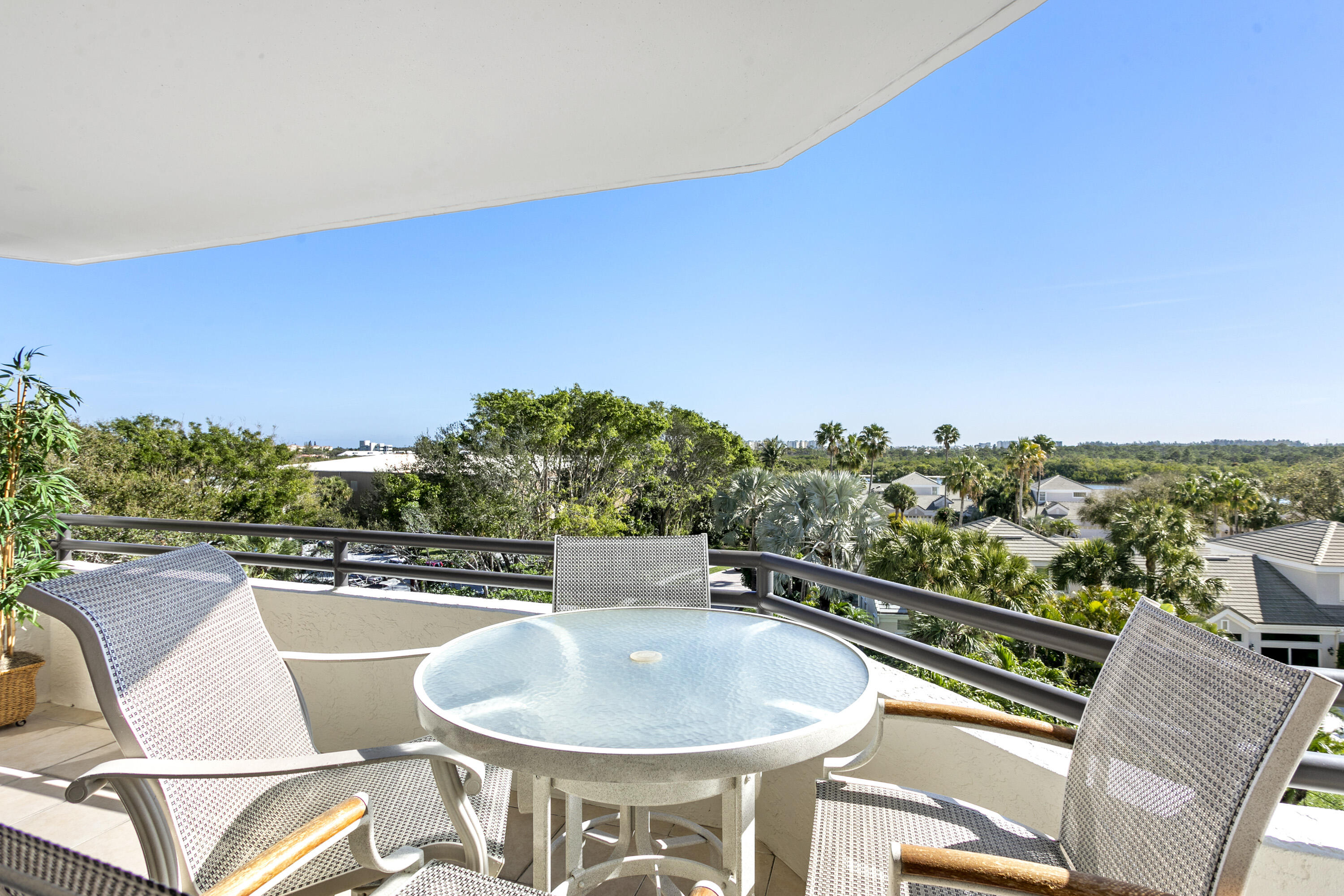 3322 Casseekey Island Road, Unit 504 Jupiter, FL 33477 - Photo 28 of 46 a terrace with outdoor seating and city view