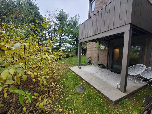 a view of backyard with cabin