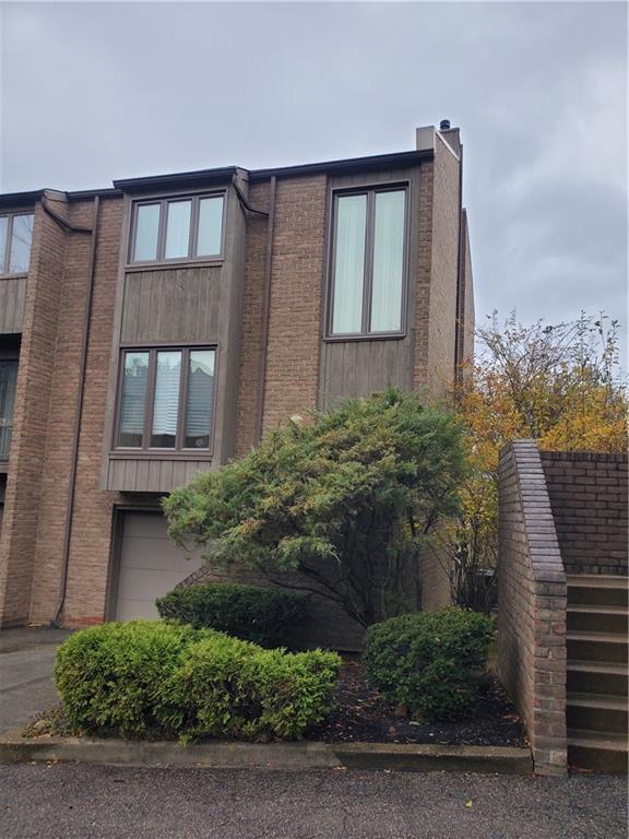 264 Elm Court Pittsburgh, PA 15237 - Photo 2 of 28 a front view of a house with a garden